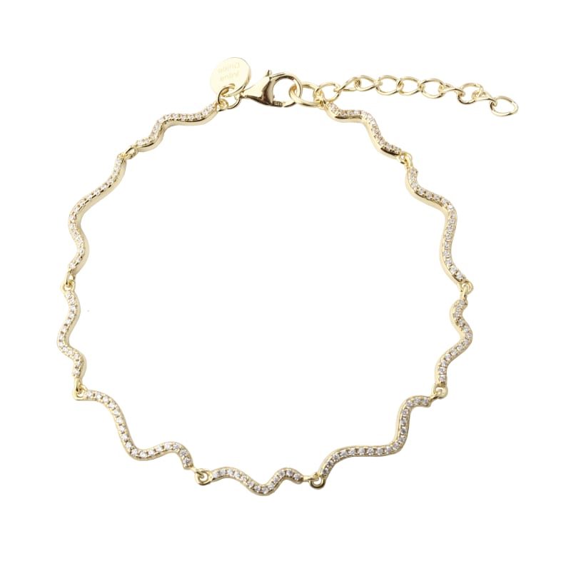 Aqua Dulce Curva Armbånd i forgyldt sølv med klare zirkoner. Et smukt dansk designarmbånd med justerbar længde 17+3 cm. Køb online i dag